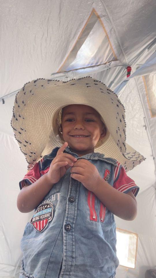 A boy in a straw hat