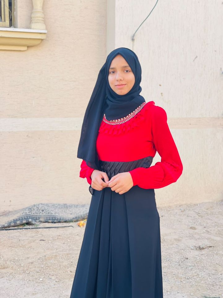 A girl in a red and black dress