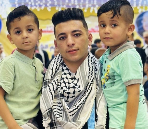 A young man from the family with two small children